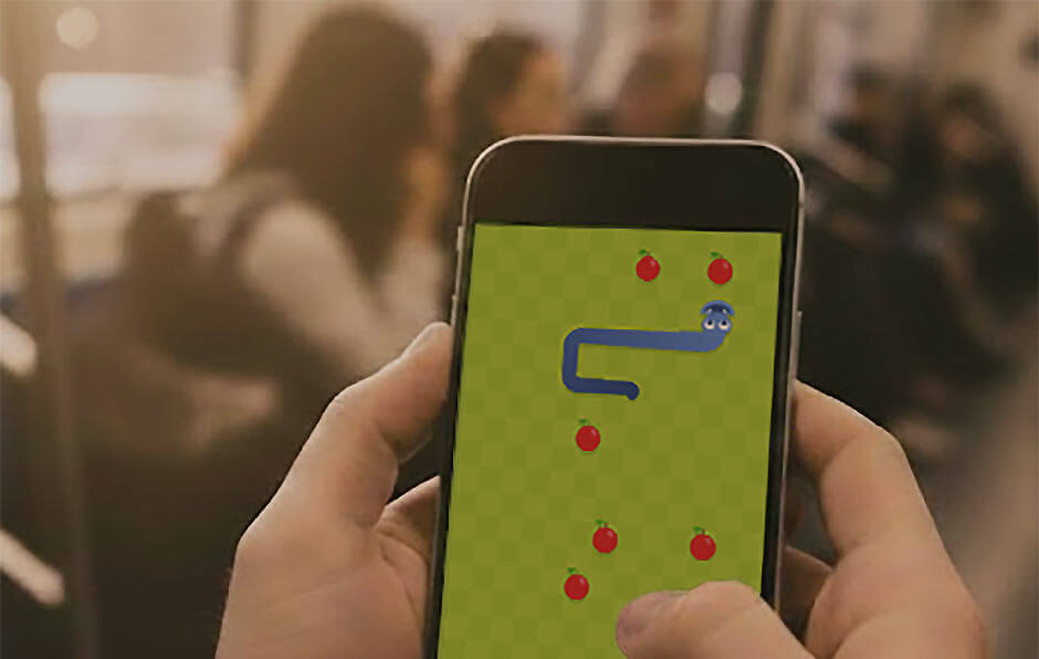 Playing Google Snake on a phone in public transport